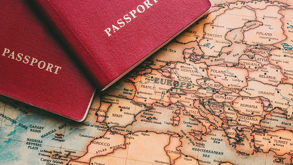 Two passports on map. Travel to Europe